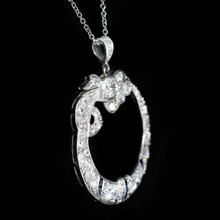 Necklaces Platinum 1911 Art Deco Diamond and Sapphire Bow Wreath Necklace